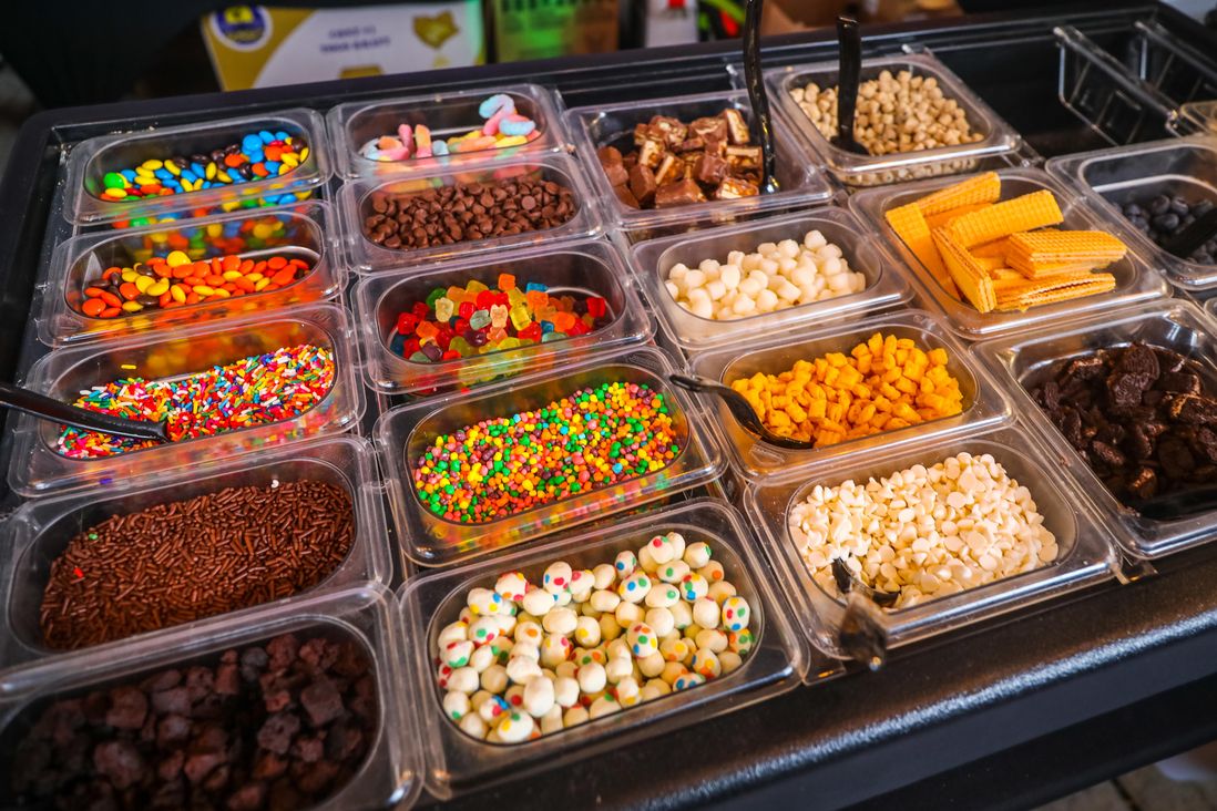 Containers of dessert toppings
